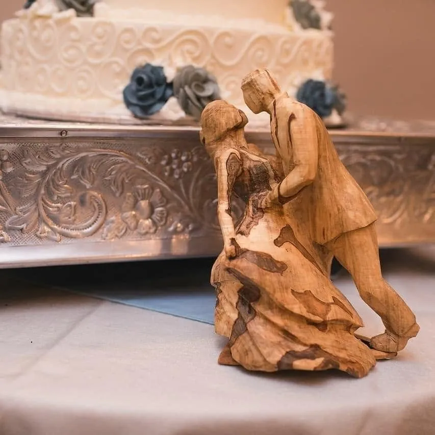 Wedding Topper Beside The Cake